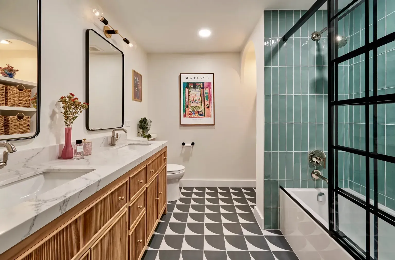 Double basin and black framed shower design in a premium North Shore remodel”
