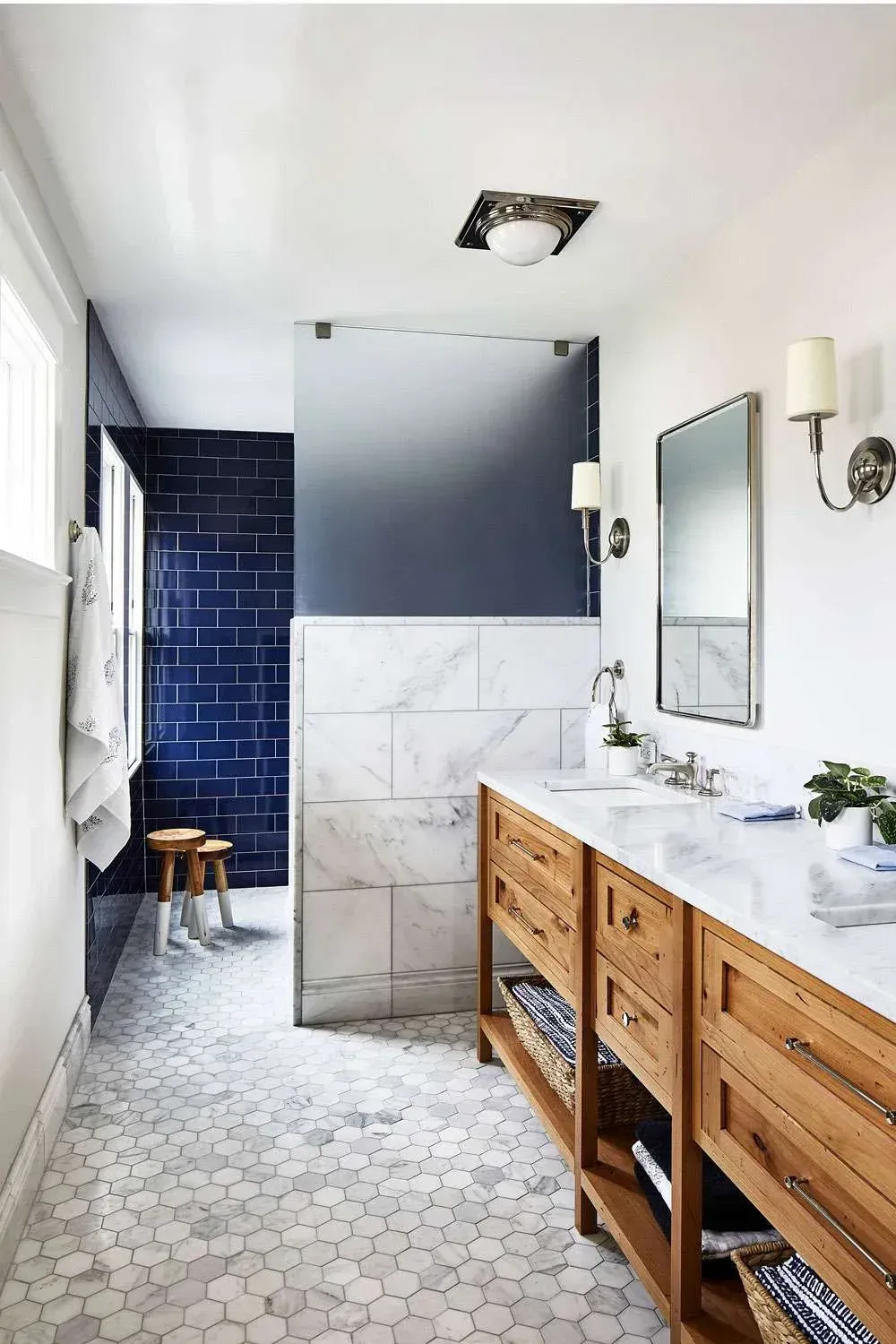 Luxury walk-in shower with blue feature tile and timber vanity in Mosman apartment”
