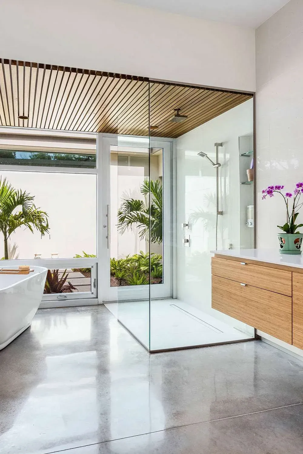 A bathroom with a walk-in shower and a bathtub lower north shore