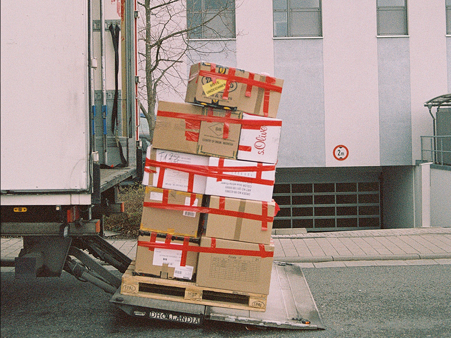 a man is working on a truck engine with a wrench .