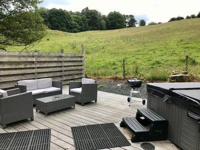 The Carrick Lodge Deck Area Seating and Barbecue at Queensland Holiday Park