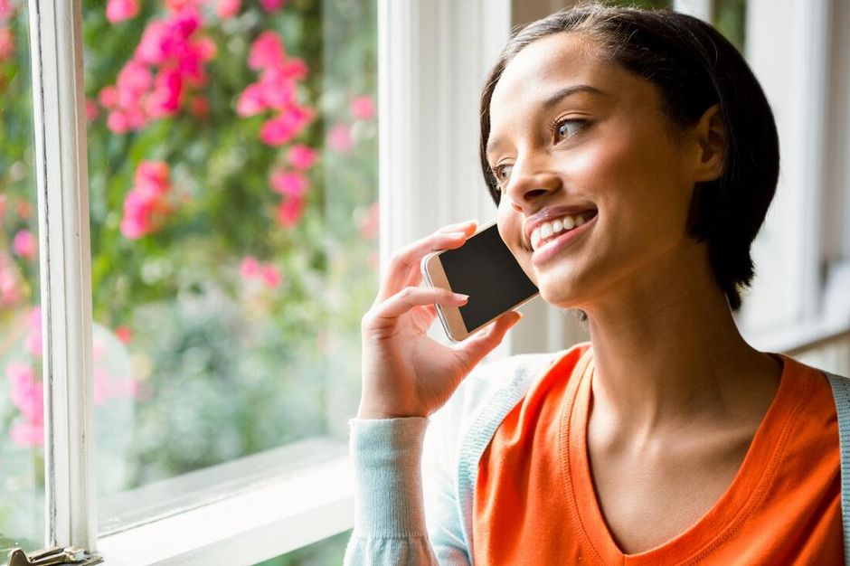 customer service smiling taking phone call