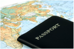 passport infront of map A passport is sitting on top of a map of the world.