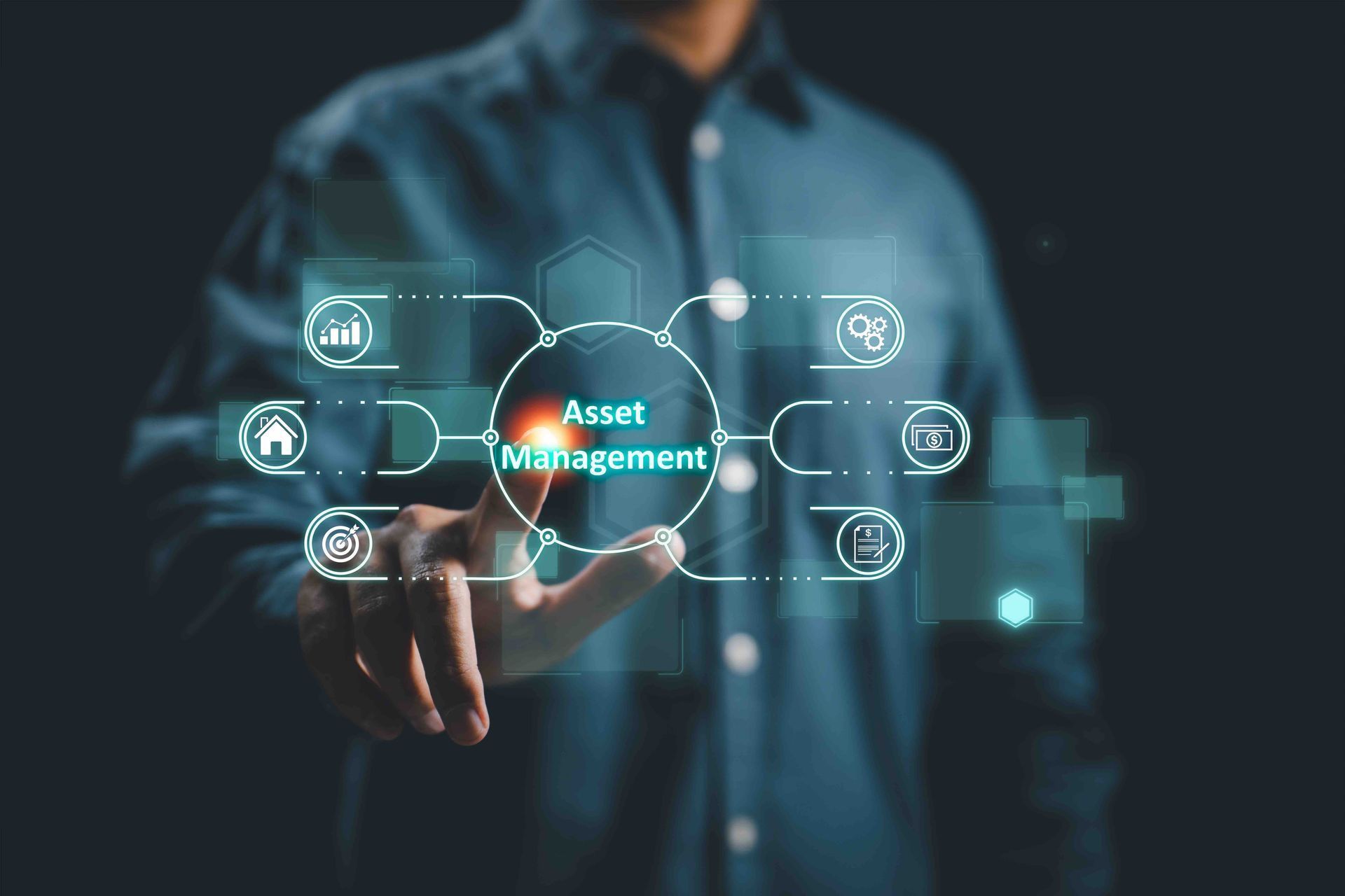 A man is pressing a button on a screen that says asset management.