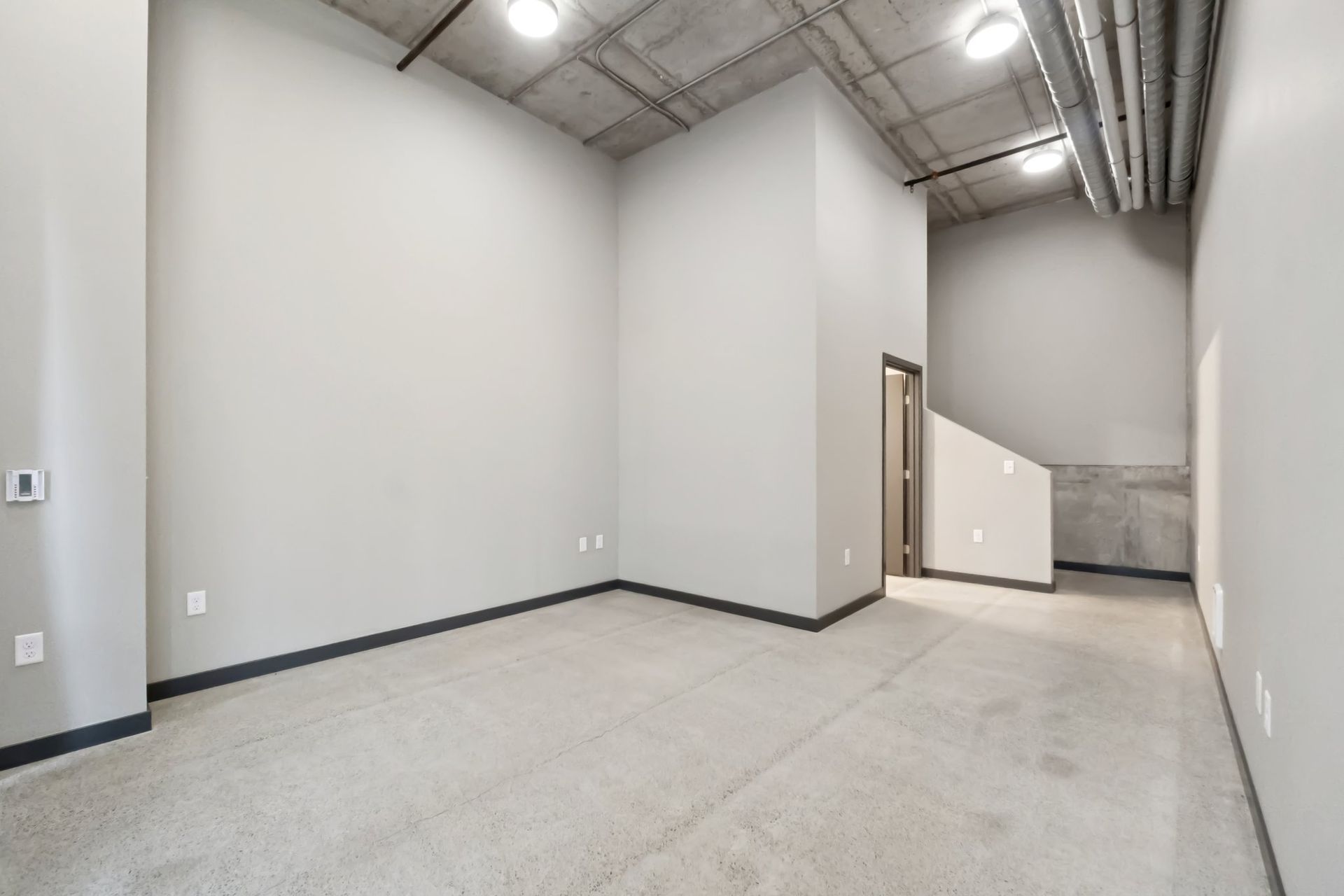 room with gray walls and gray floors