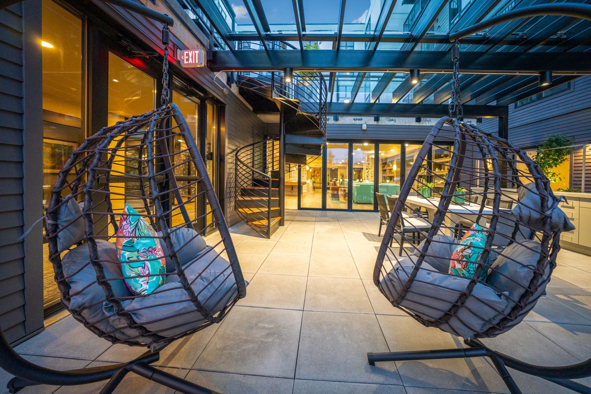 sitting area with hanging chairs
