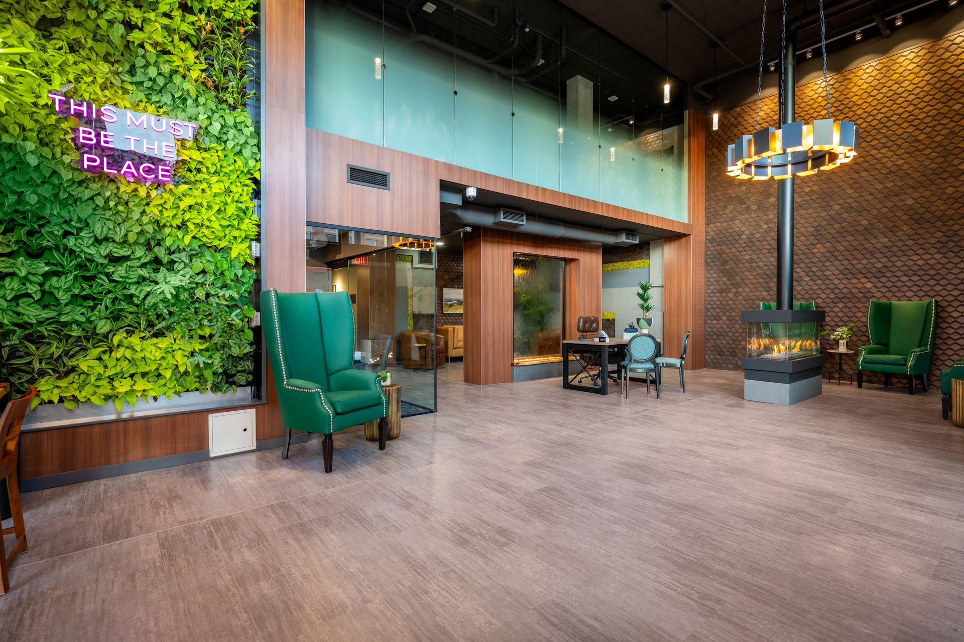 lobby and seating area with living plant wall