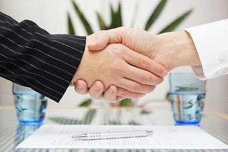 Shaking Hands over Signed Contact - Attorneys in Westminister, MD