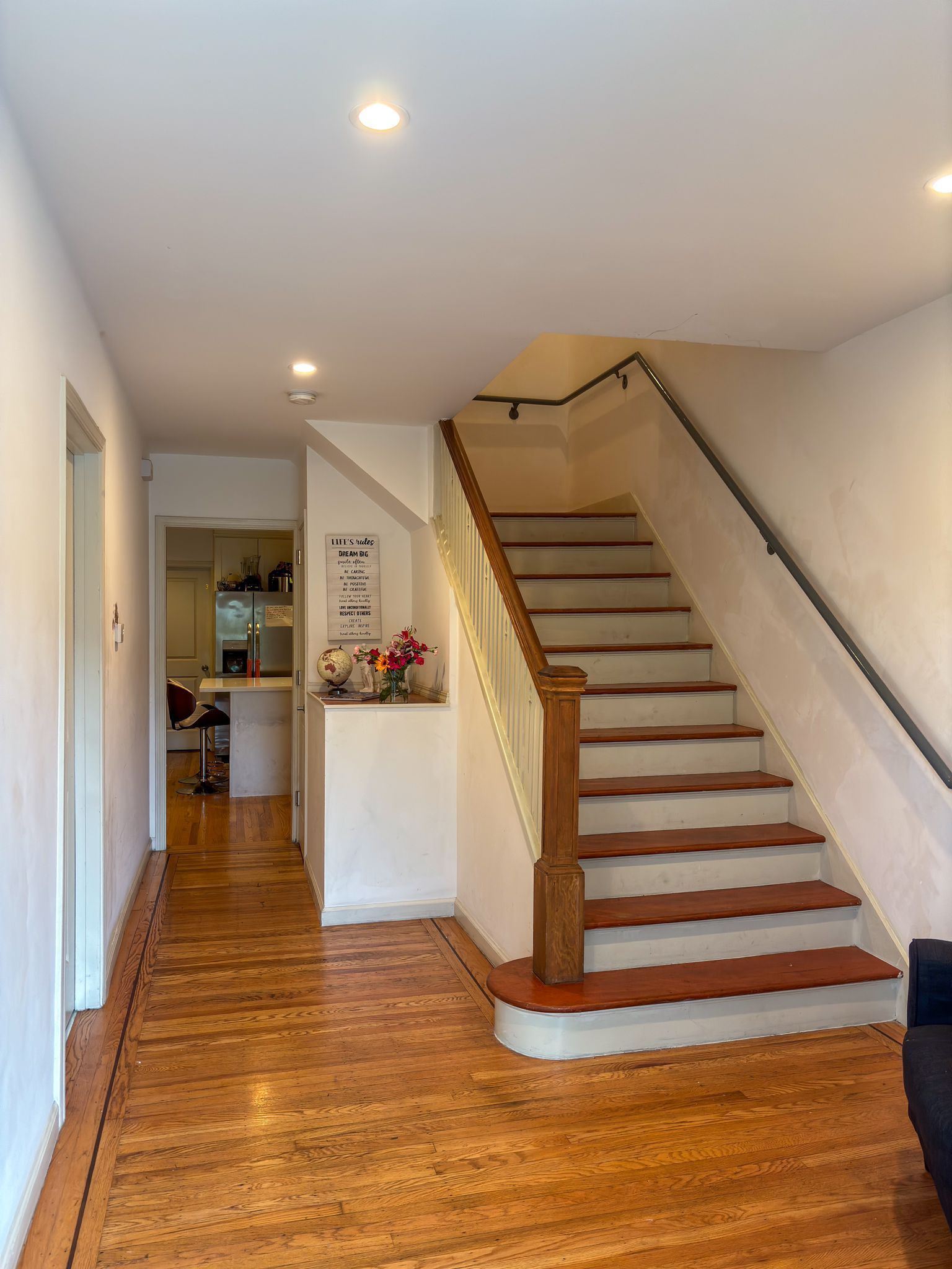 A bedroom with two bunk beds and a couch