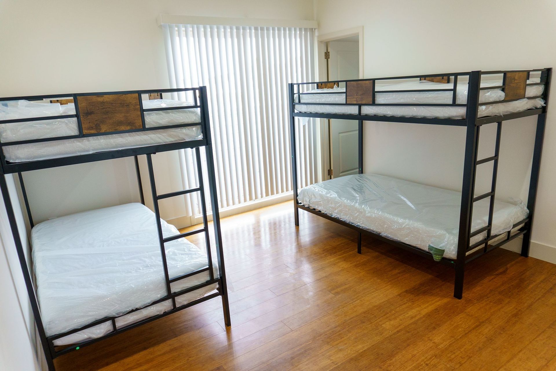 A bedroom with two bunk beds and a couch