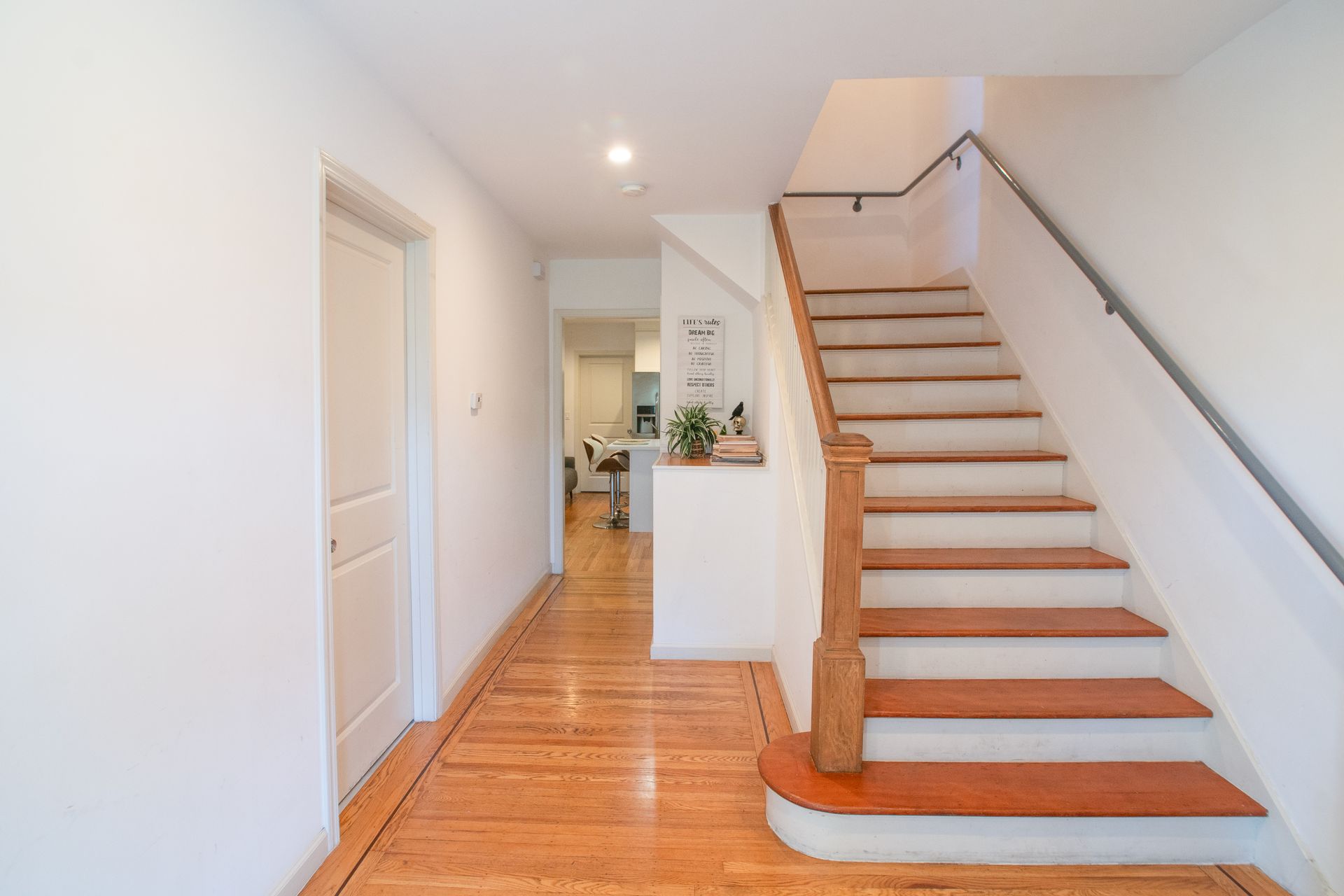 A living room with a couch a table and a television