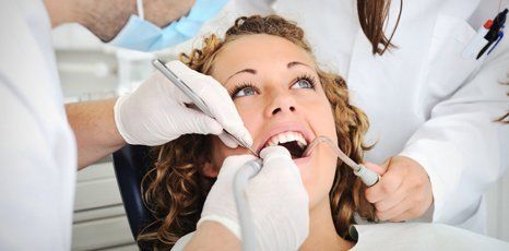 Lady undergoing dental treatment