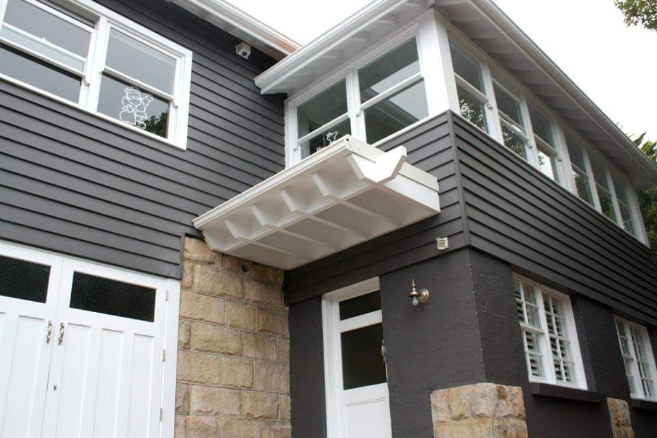 Skilled Worker Airbrush-Painting a Ship Hull — Painters in Cessnock, NSW