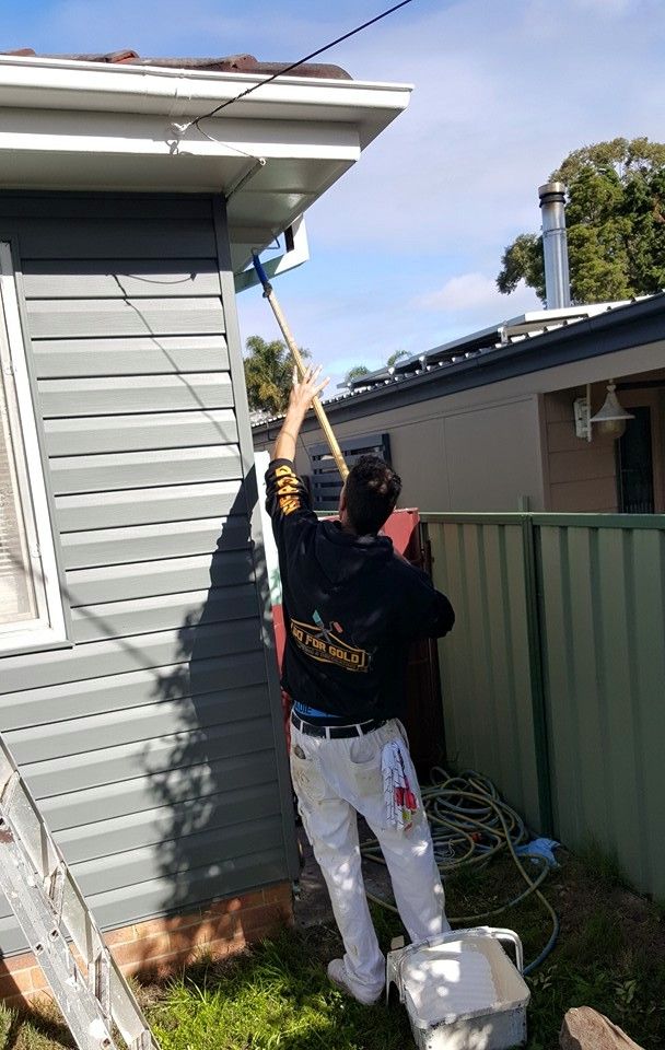 Man Painting Outdoor House — Painting Services in the Hunter Valley, NSW