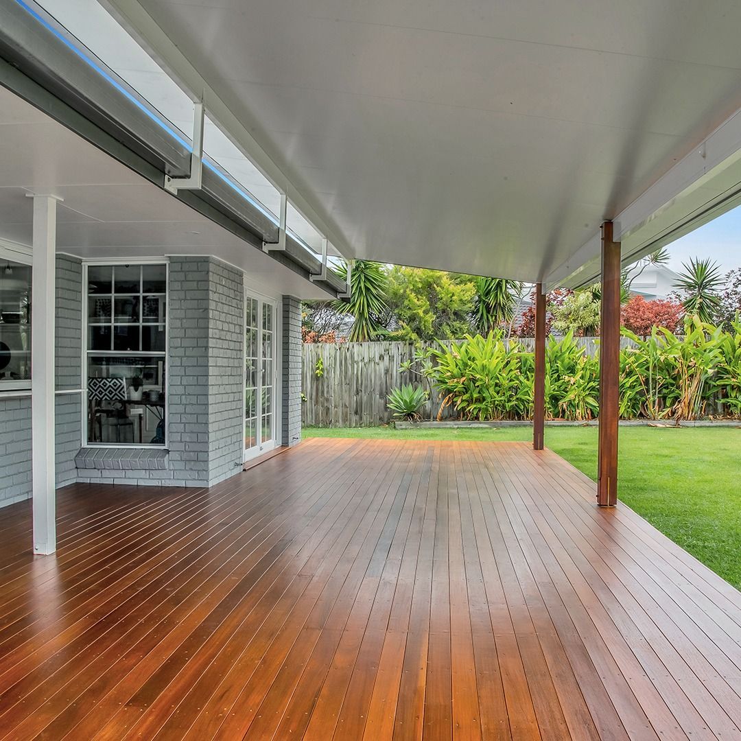 Man on a Lifting Platform Painting the Building Wall — Painters in Muswellbrook, NSW