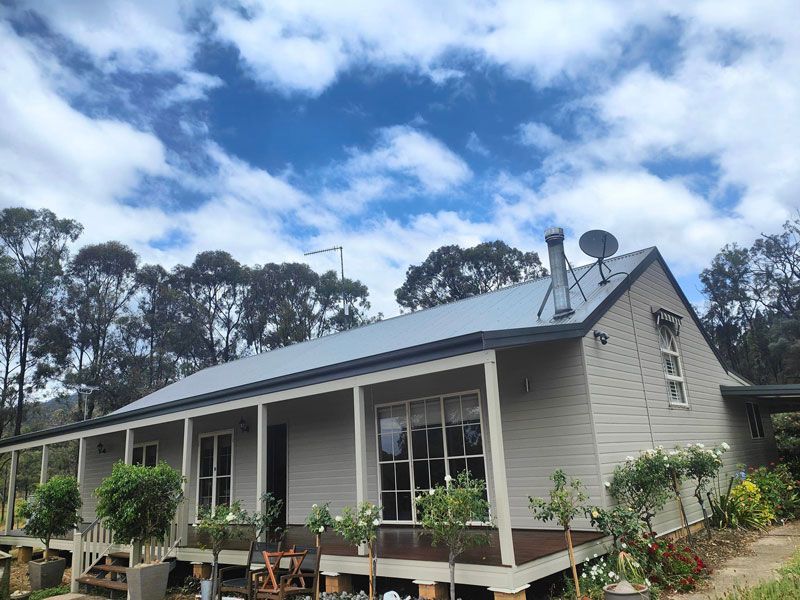 Exterior of a Home Adorned with Lush Outdoor Plants — Painters in Scone, NSW