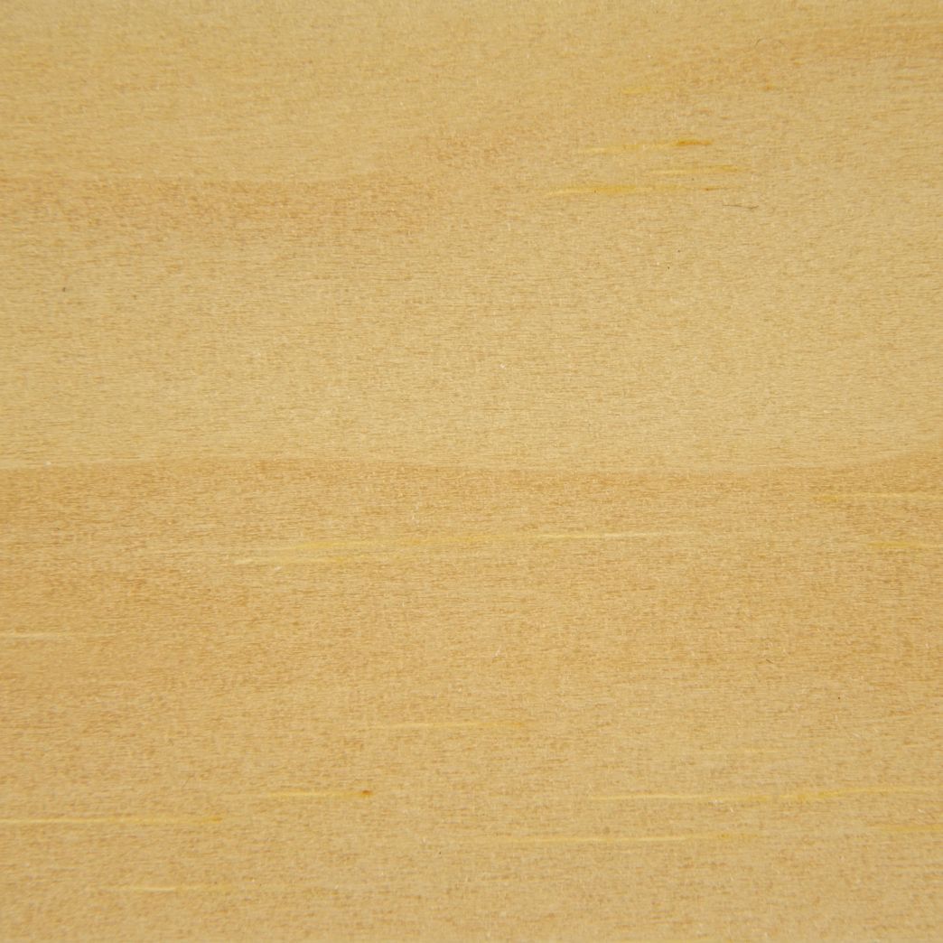 A close up of a piece of wood showing the texture of the wood.