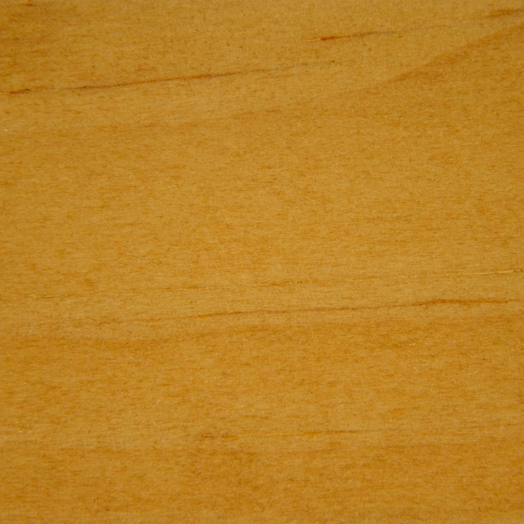 A close up of a piece of wood showing the grain and texture.