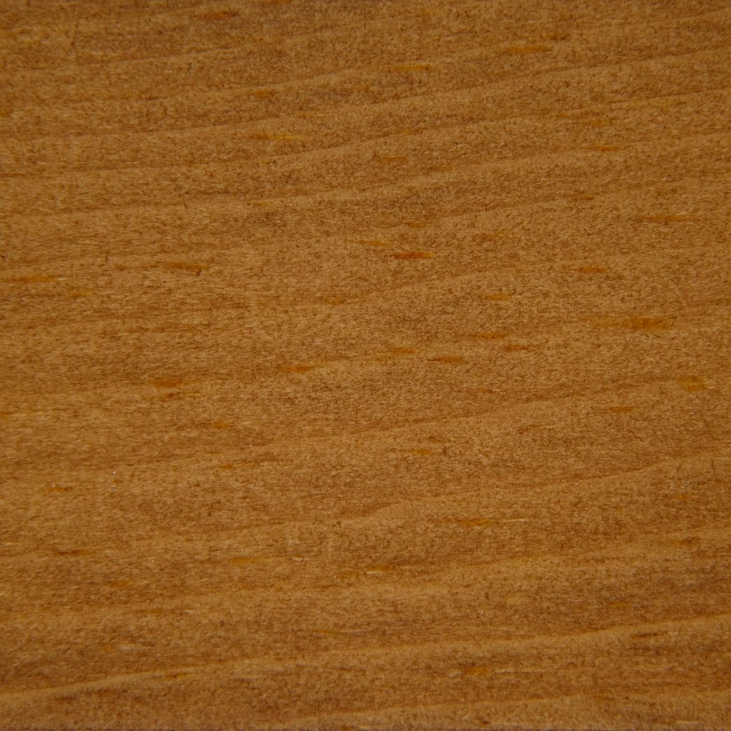 A close up of a piece of wood showing the grain and texture.