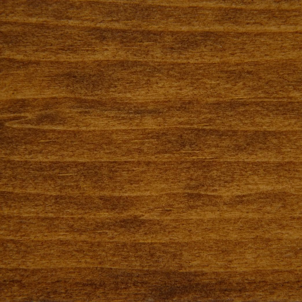 A close up of a piece of wood showing the grain and texture.