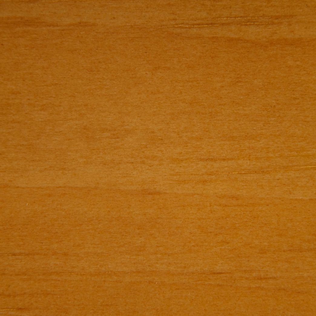 A close up of a piece of wood showing the grain and texture.