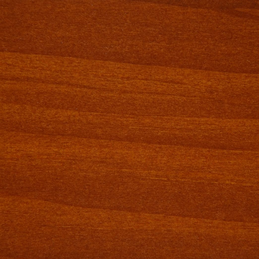 A close up of a piece of wood showing the grain and texture.