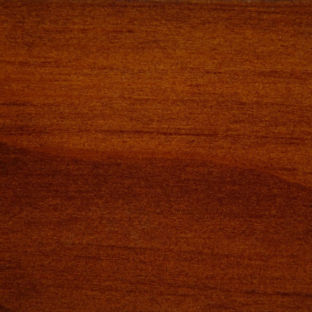 A close up of a piece of wood showing the grain and texture.