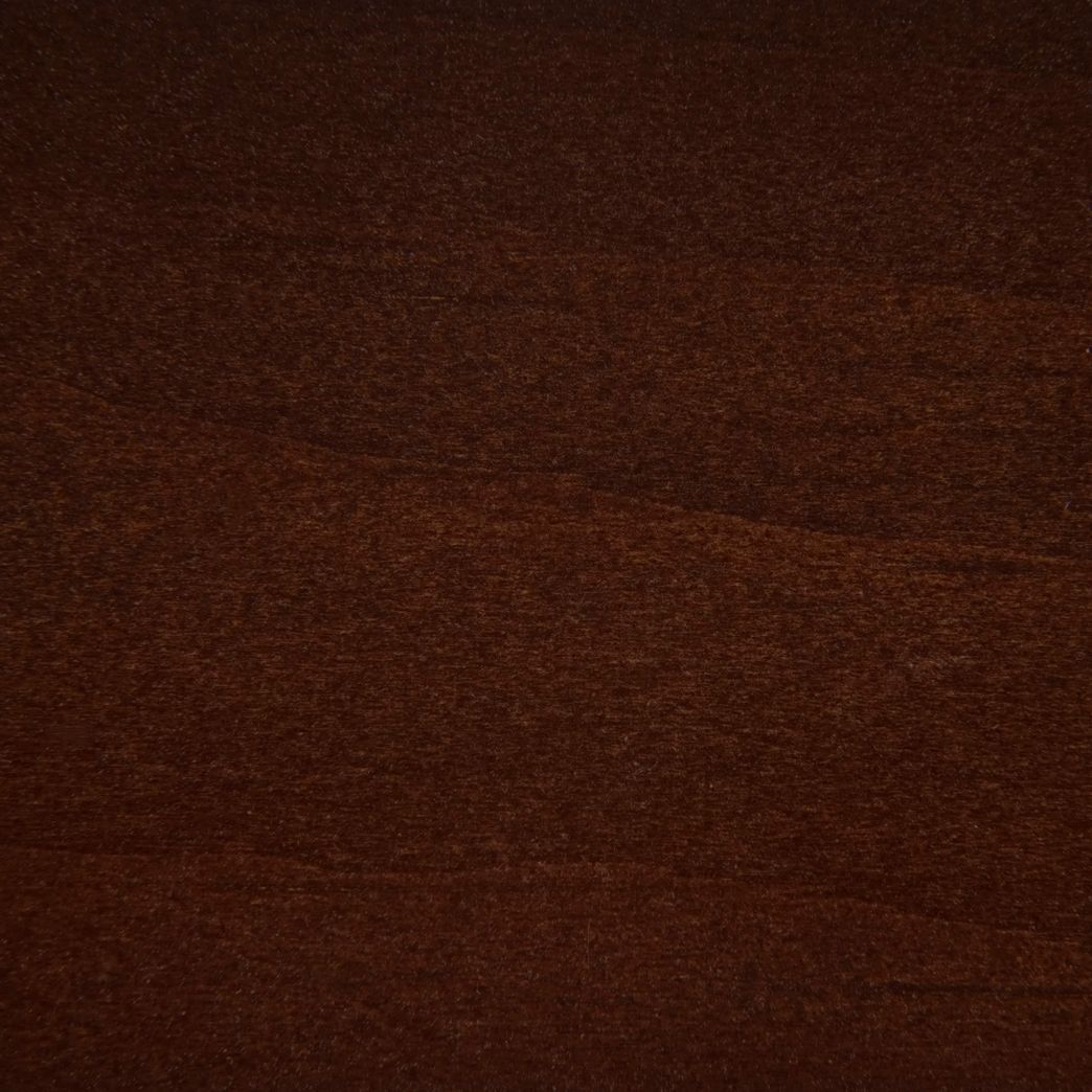 A close up of a piece of dark brown wood.