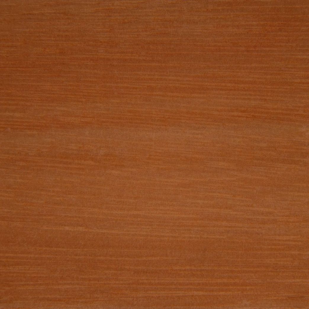 A close up of a piece of wood showing the texture of the wood.