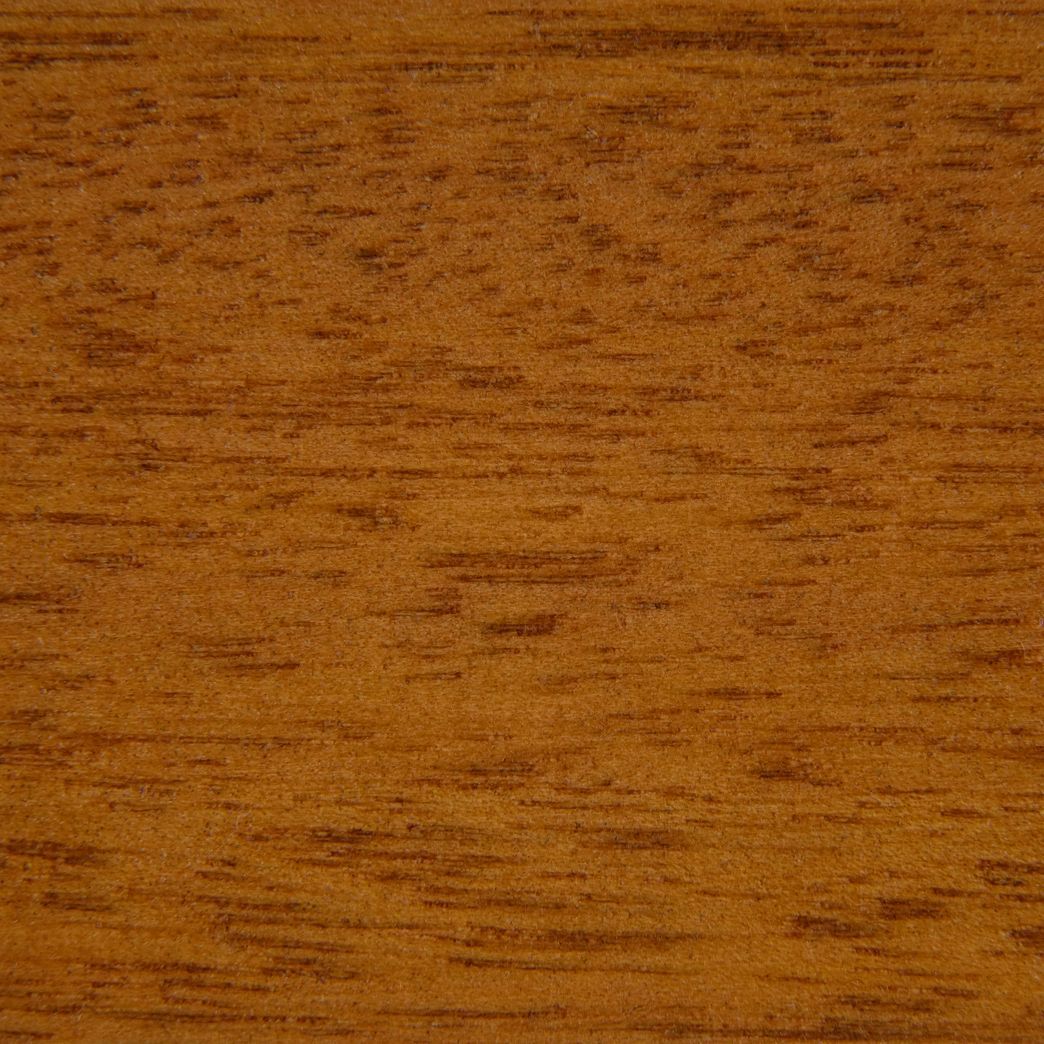 A close up of a piece of wood showing the grain and texture.
