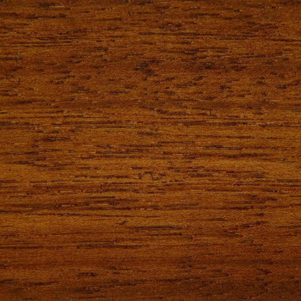 A close up of a piece of wood showing the grain and texture.