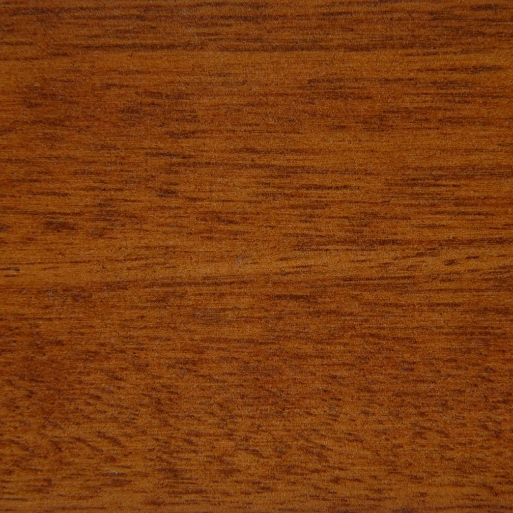 A close up of a piece of wood showing the grain and texture.