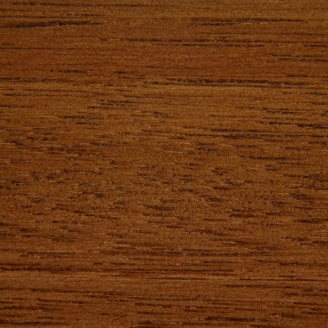 A close up of a piece of wood showing the grain and texture.