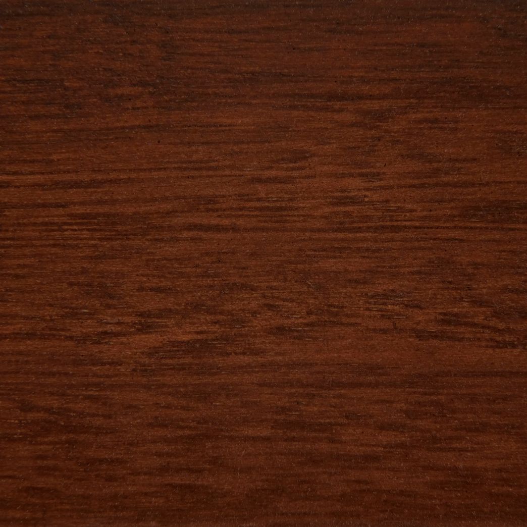 A close up of a piece of dark wood.