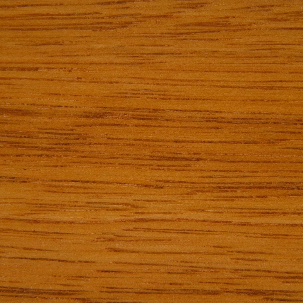A close up of a piece of wood showing the grain and texture.