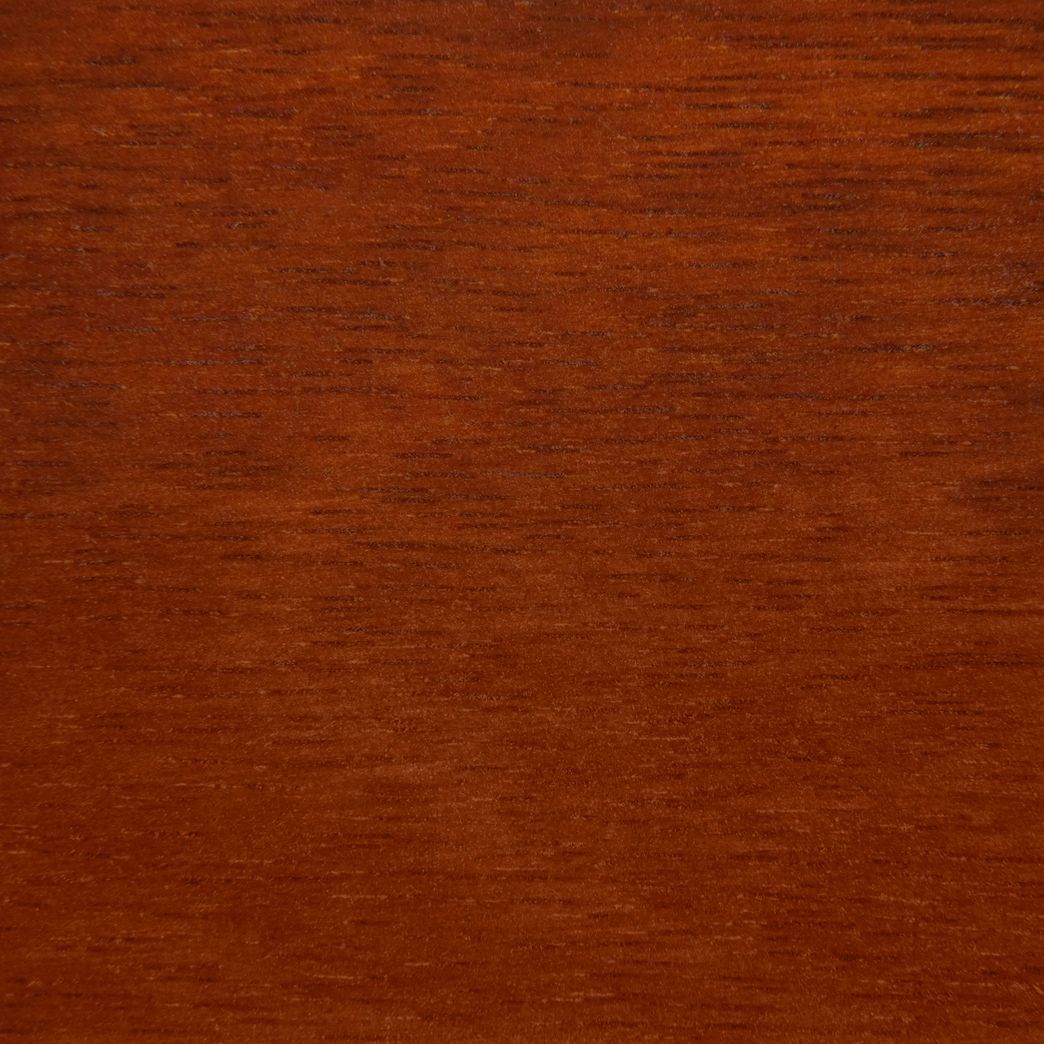 A close up of a piece of wood showing the texture of the wood.