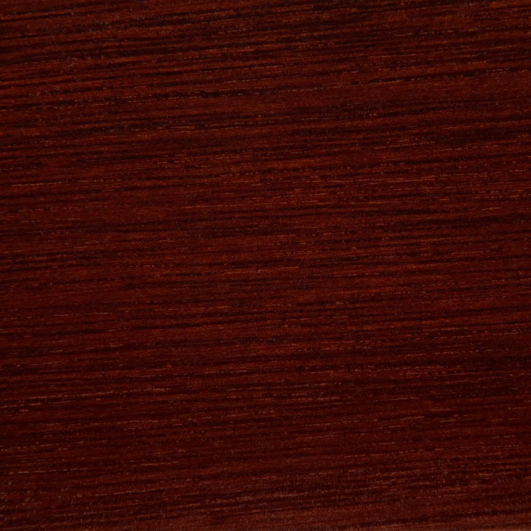 A close up of a piece of mahogany wood.