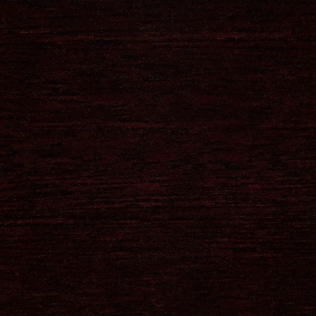 A close up of a dark brown wood grain texture.