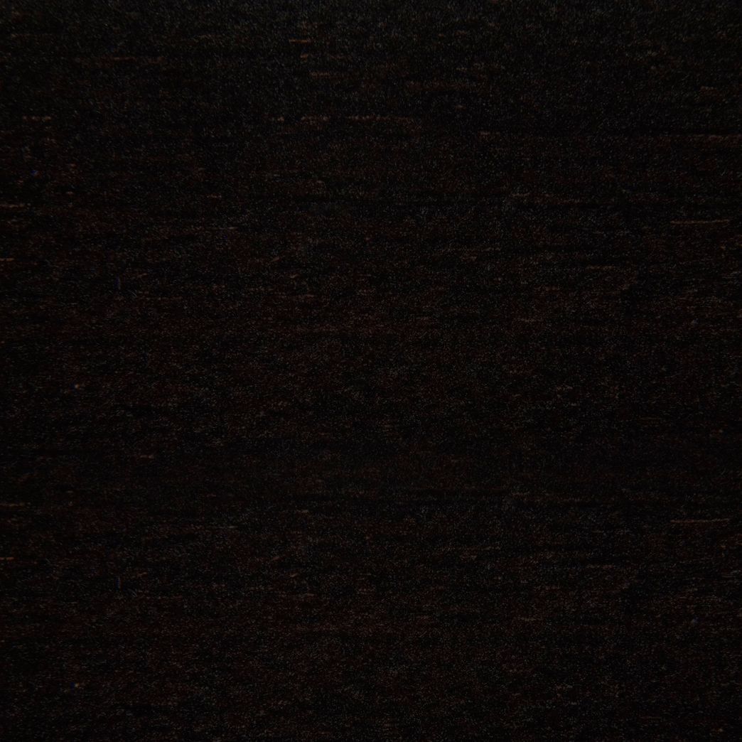 A close up of a black carpet texture.