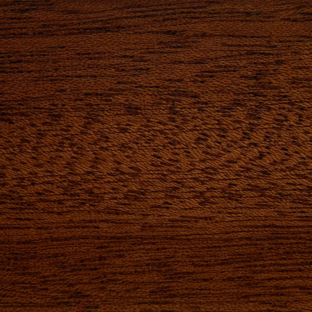 A close up of a piece of brown wood.