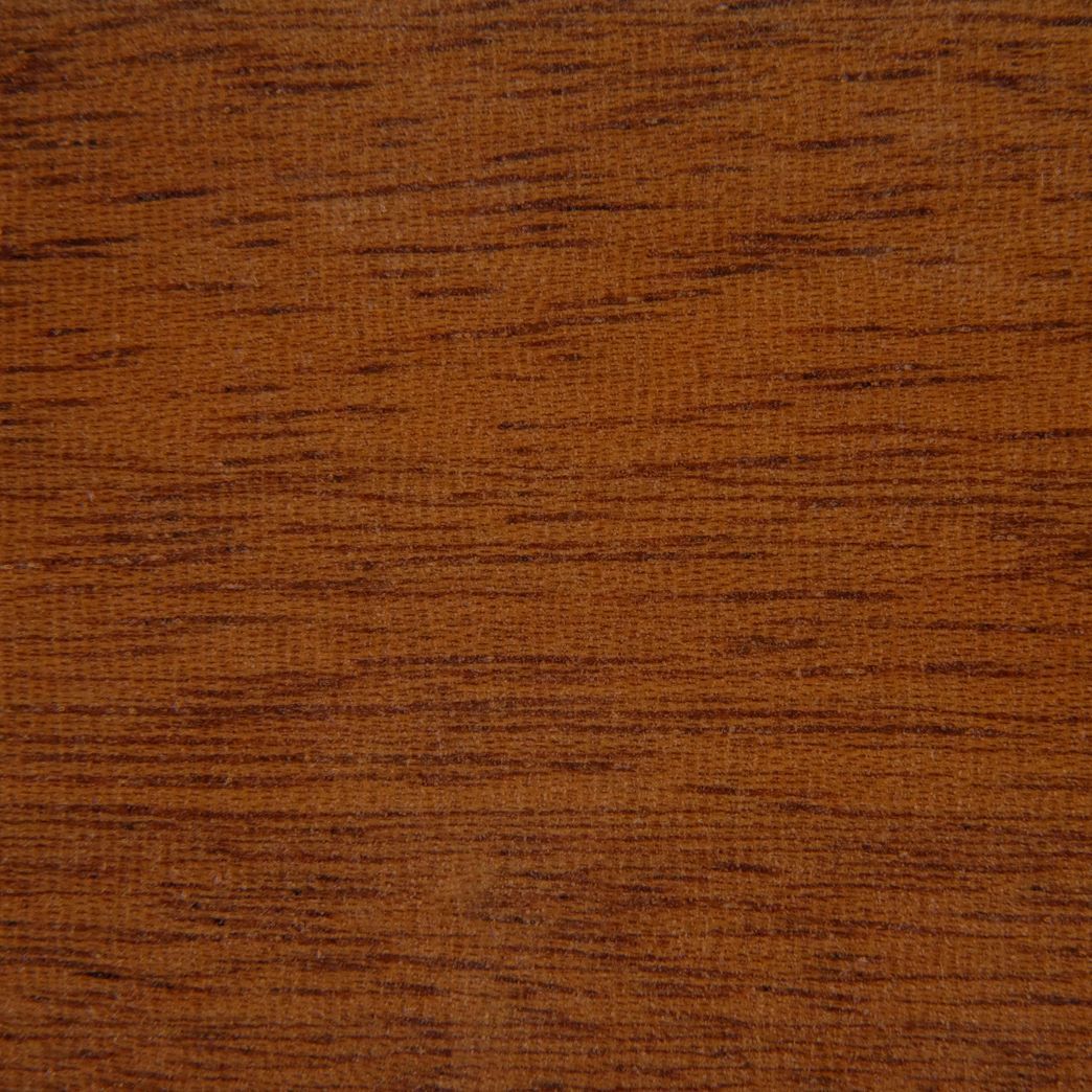 A close up of a piece of wood showing the texture of the wood.