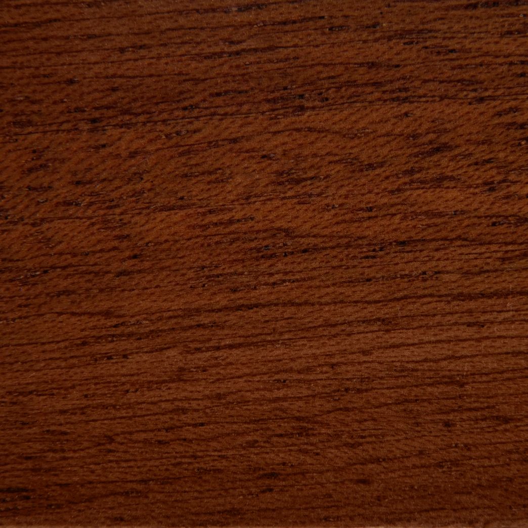A close up of a piece of wood showing the grain and texture.