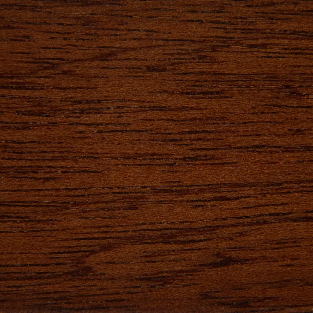 A close up of a piece of brown wood.