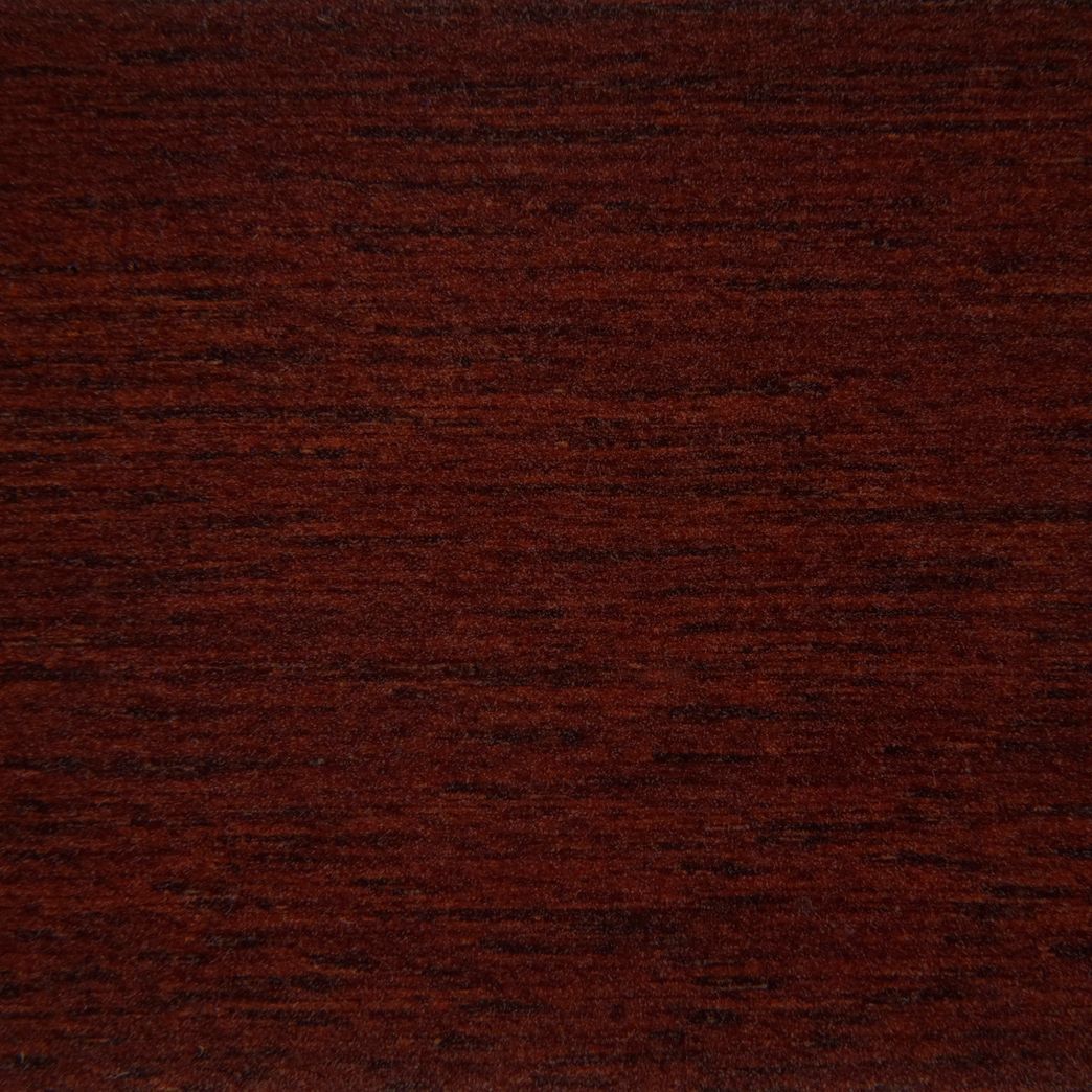 A close up of a piece of mahogany wood.