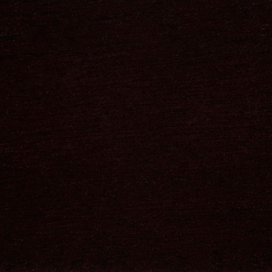 A close up of a dark brown fabric texture.