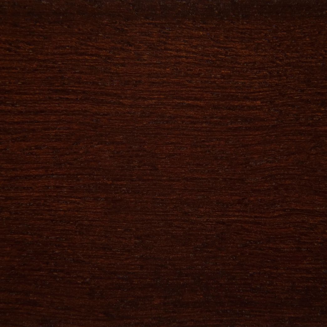 A close up of a piece of dark wood.