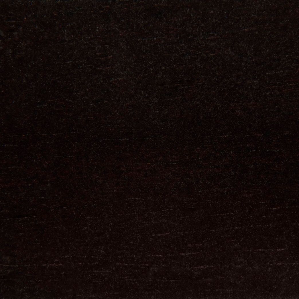 A close up of a black carpet texture.