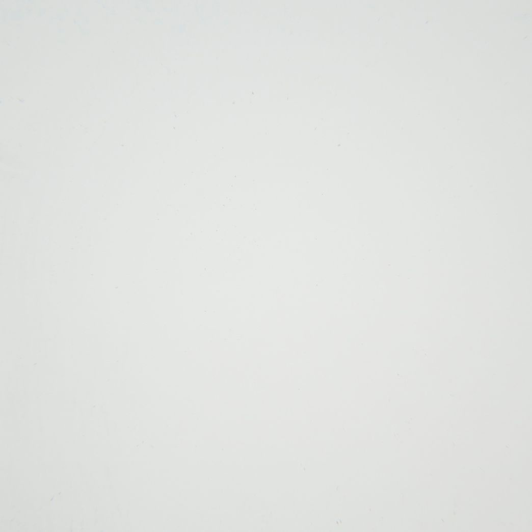 A close up of a white paper texture.