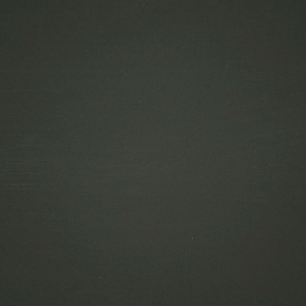 A close up of a black background with a grainy texture.