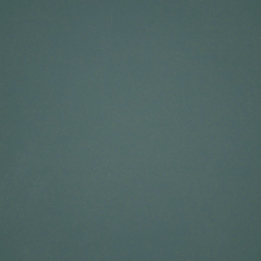 A close up of a gray background with a grainy texture.